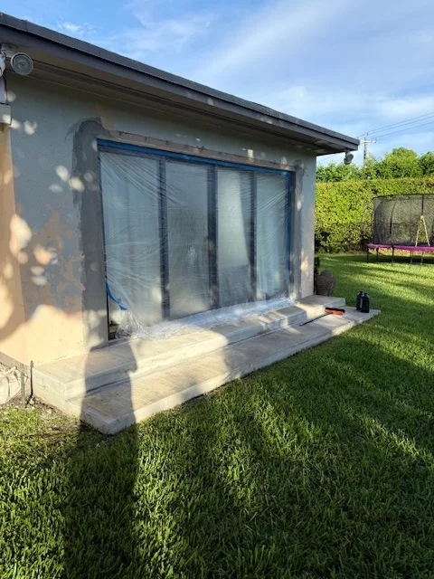 Bare concrete back step before travertine tile, Miami, FL