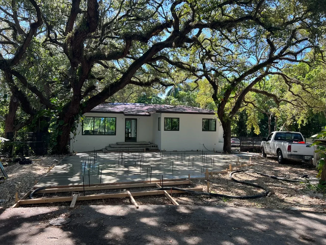 Driveway forms staked out from the street before a concrete pour, Miami, FL