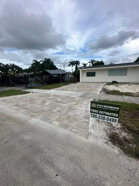 Finished paver driveway with the Paverson yard sign out front, Miami, FL