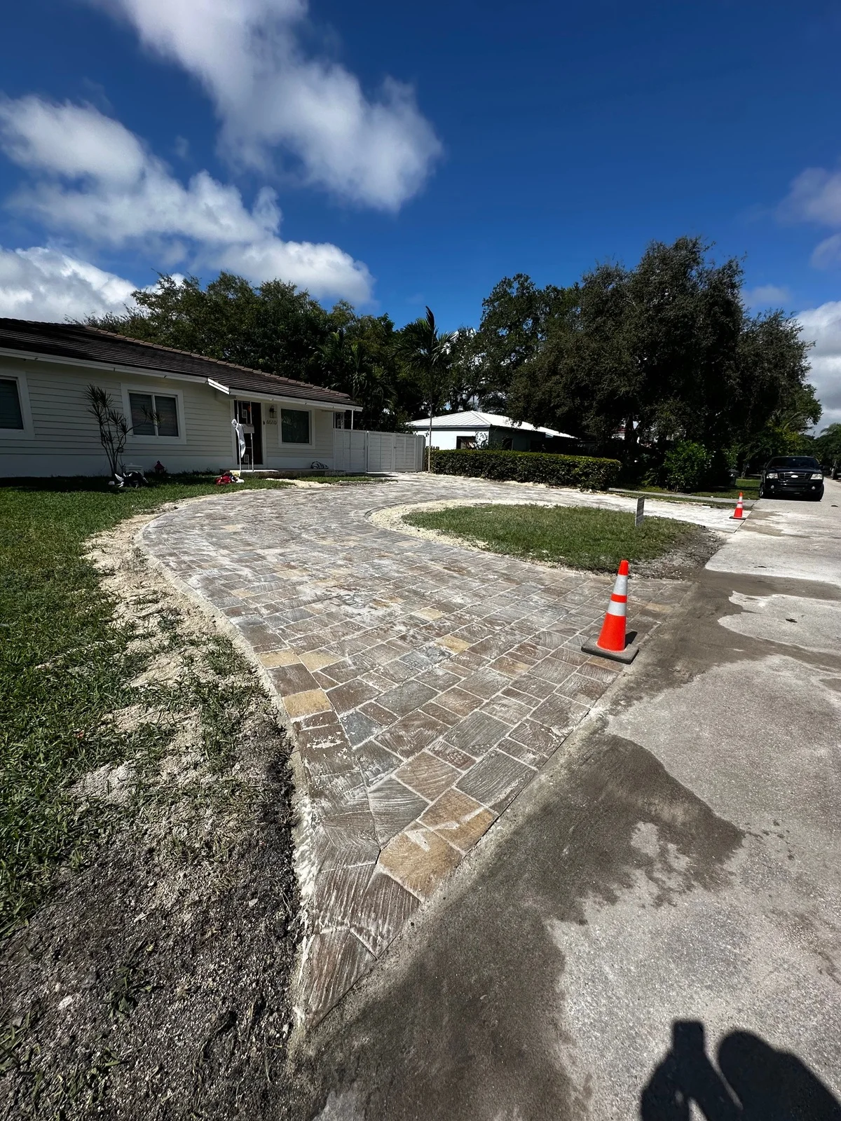 Bedding sand screeded inside the first paver ring of a circular driveway, Miami, FL