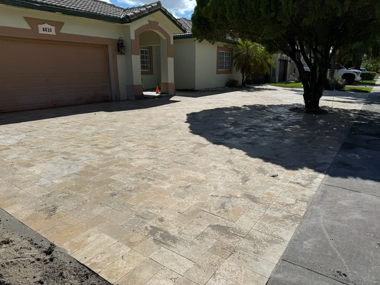 Travertine paver driveway across the front of a house, Miami, FL
