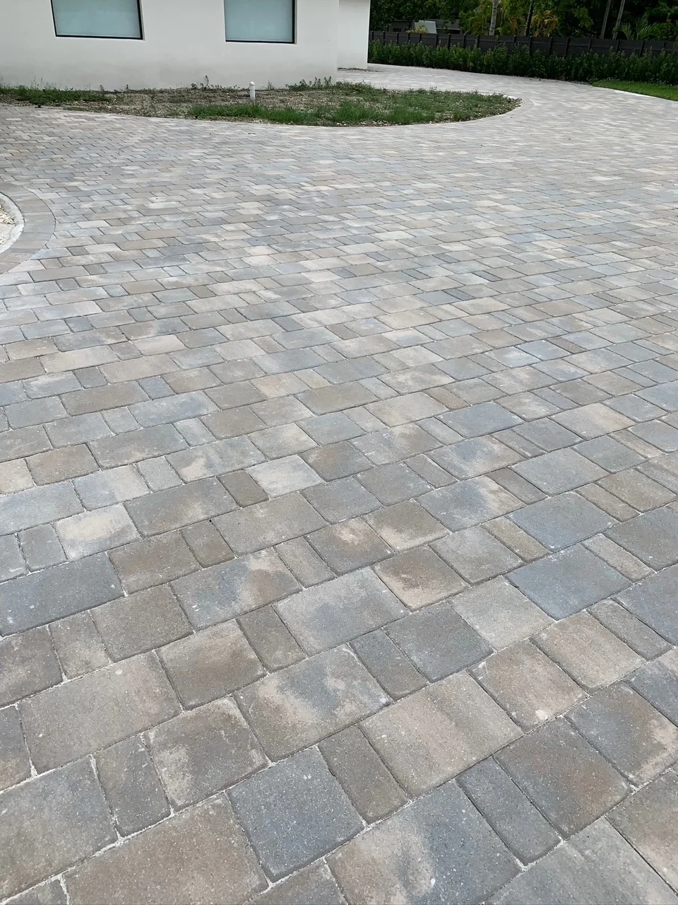 Grey tumbled pavers laid alongside the house toward the back drive, Miami, FL