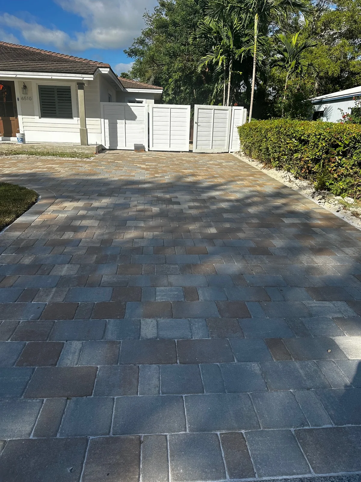 Tumbled multicolor pavers running up to a garage door, Miami, FL